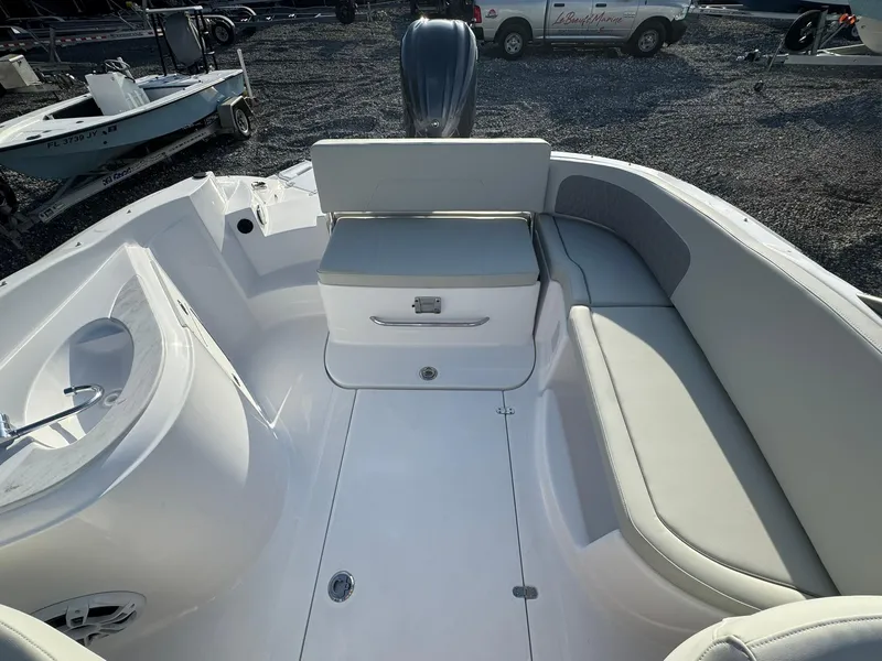 Slide: The Image of 2025 SouthWind 2600 boat interior with white seating and storage compartment. - 11