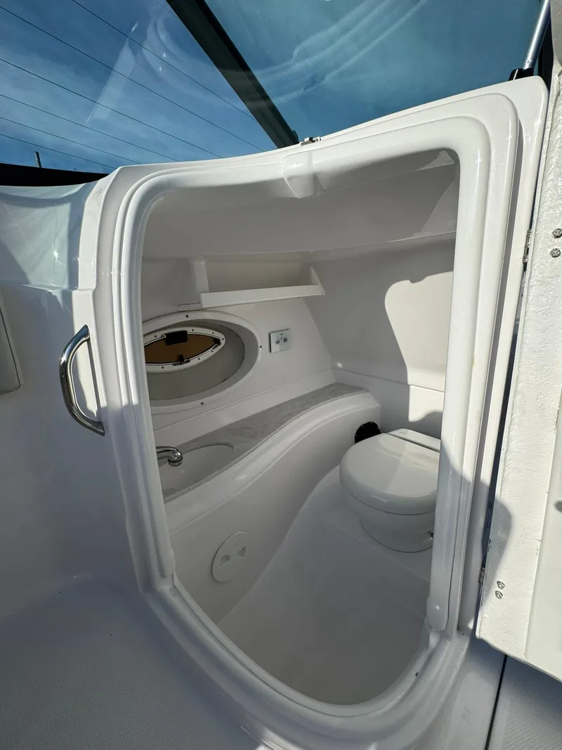 Slide: The Image of 2025 SouthWind 2600 boat interior with compact bathroom and modern amenities. - 12