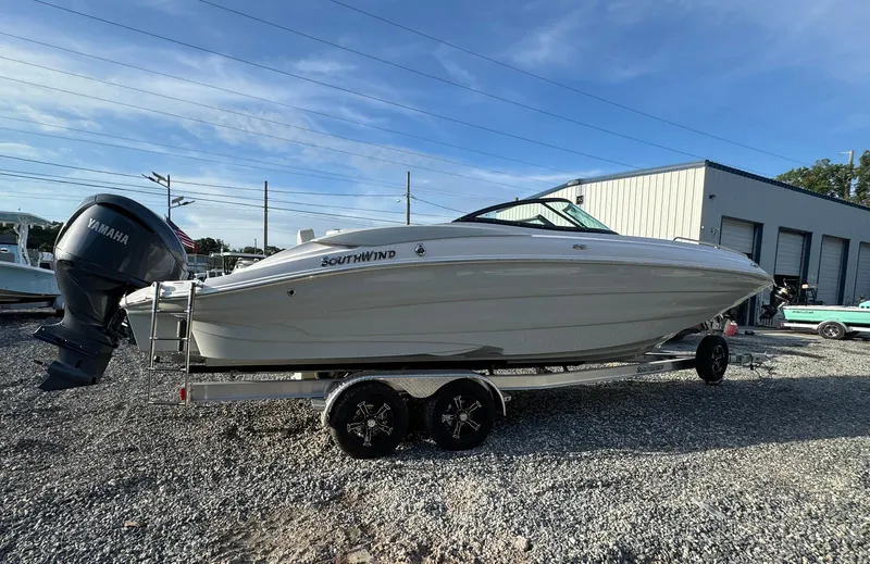 Slide: The Image of 2025 SouthWind 2600 boat on trailer, parked outdoors, with Yamaha outboard motor. - 14