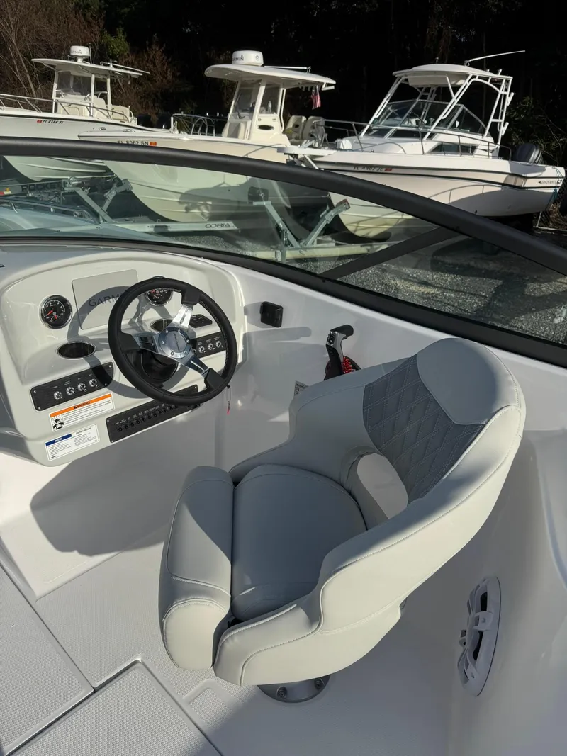 Slide: The Image of 2025 SouthWind 2600 boat interior with steering wheel and captain's chair. - 6