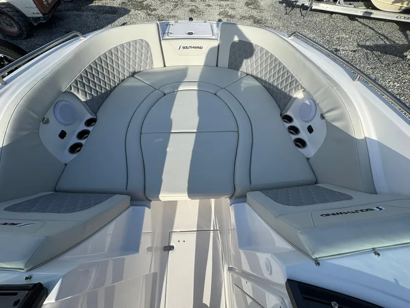 Slide: The Image of 2025 SouthWind 2600 boat interior with cushioned seating and speaker system. - 8