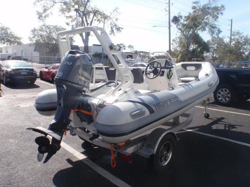 Slide: The Image of 2023 Highfield Sport 420 boat with Yamaha engine on trailer in parking lot. - 3