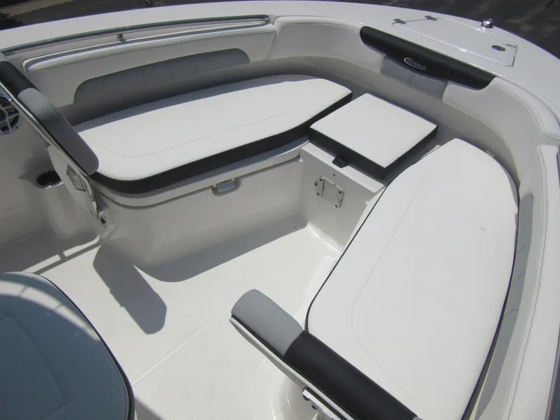 Slide: The Image of 2025 Robalo R202 Explorer boat interior with cushioned seating and storage compartments. - 25