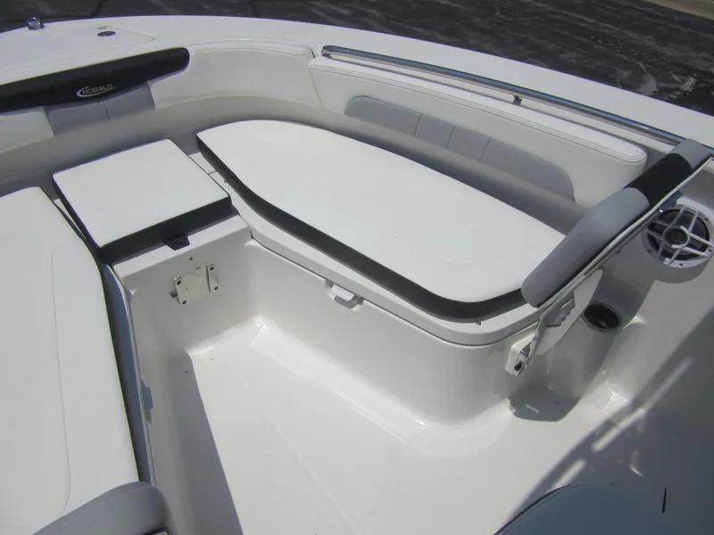 Slide: The Image of 2025 Robalo R202 Explorer boat interior with cushioned seating and storage. - 26