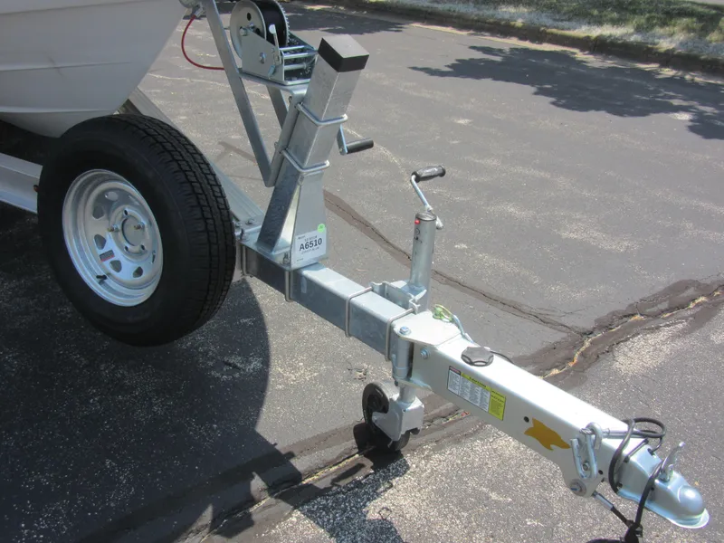 Slide: The Image of Trailer hitch of 2025 Robalo R202 Explorer boat on pavement. - 4