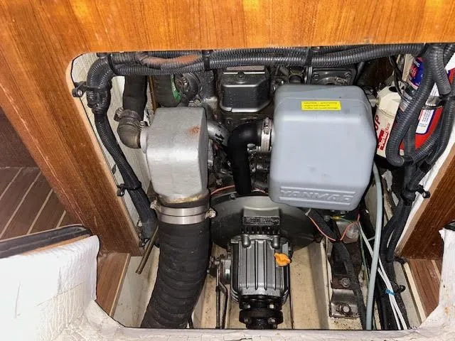 Slide: The Image of Engine compartment of a 2006 Hunter 38 sailboat, featuring a Yanmar engine. - 11