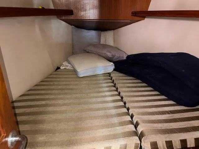 Slide: The Image of Wooden cabinet inside 2006 Hunter 38 boat interior. - 13