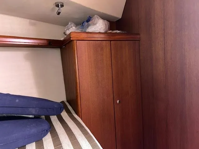 Slide: The Image of Electrical control panel on a 2006 Hunter 38 yacht, featuring battery and generator switches. - 15