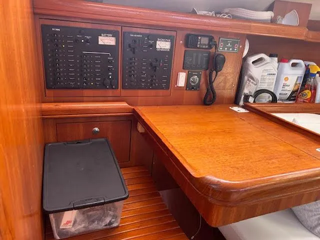 Slide: The Image of Interior of a 2006 Hunter 38 sailboat with cozy seating and modern amenities. - 17