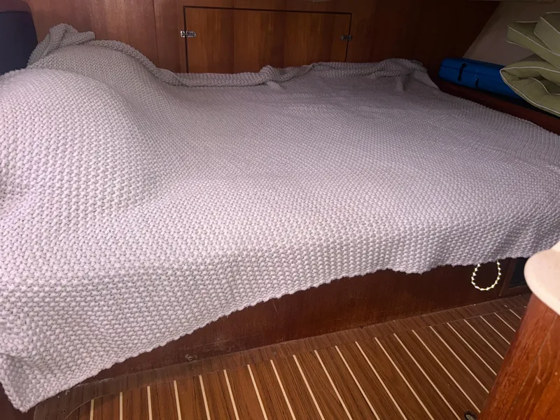 Slide: The Image of Interior of 2006 Hunter 38 sailboat kitchen with wooden cabinetry and appliances. - 27