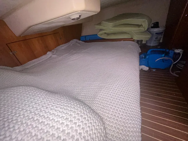 Slide: The Image of Interior of 2006 Hunter 38 sailboat with wood finish and seating area. - 29