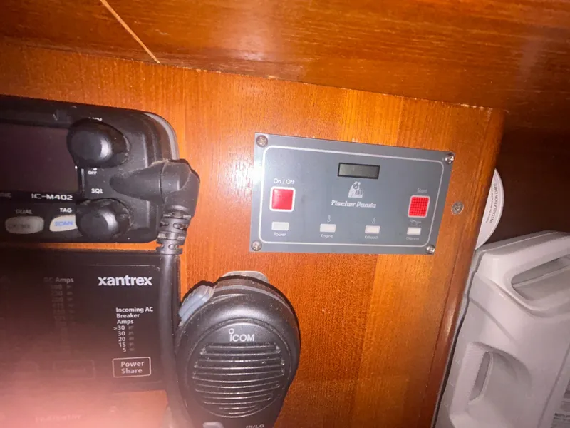 Slide: The Image of Control panel on a 2006 Hunter 38 yacht, mounted on polished wood surface. - 31