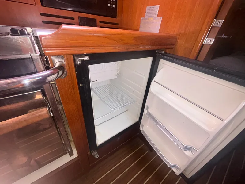 Slide: The Image of Solar panel installation on a 2006 Hunter 38 sailboat under clear blue sky. - 35