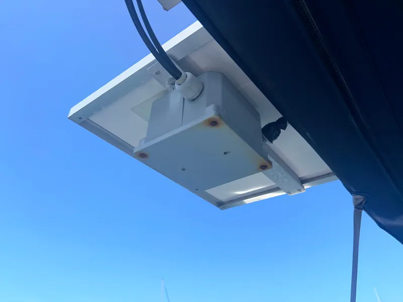 Slide: The Image of Interior of 2006 Hunter 38 sailboat with cozy seating and wooden table. - 36