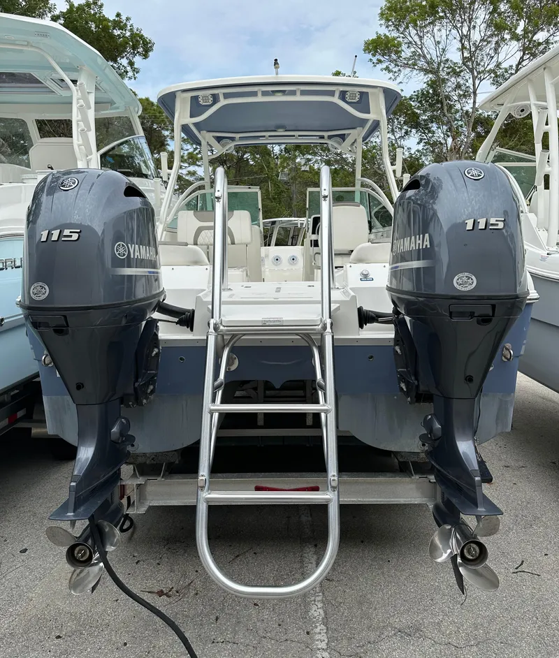 Slide: The Image of 2021 World Cat 230 DC boat with dual Yamaha 115 engines, rear view. - 3