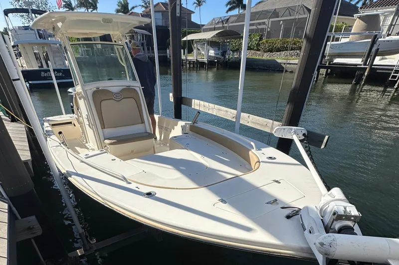 Slide: The Image of 2017 Scout 251 XS boat docked in a marina, sunny day. - 12