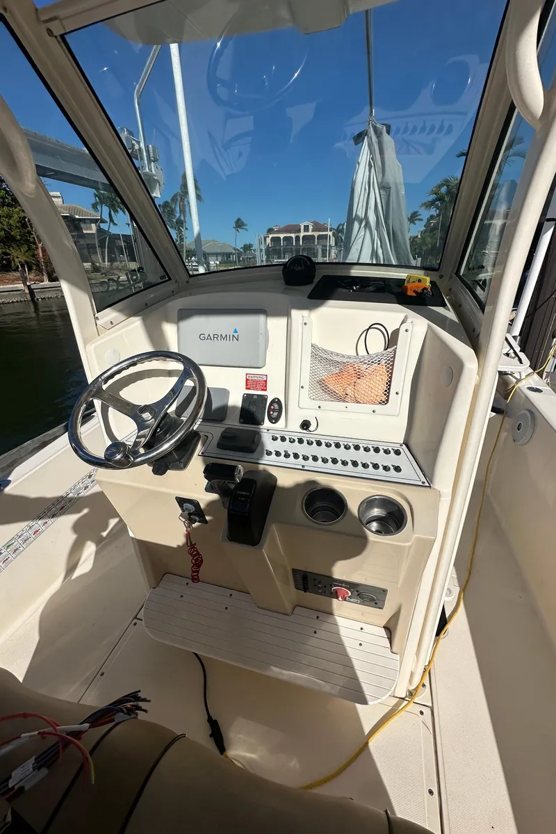 Slide: The Image of 2017 Scout 251 XS boat cockpit with steering wheel and Garmin navigation system. - 5