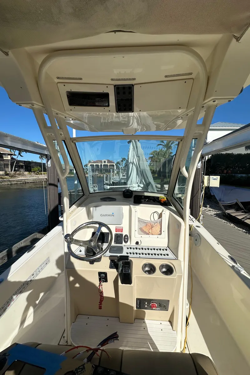 Slide: The Image of 2017 Scout 251 XS boat cockpit with steering wheel and control panel. - 6