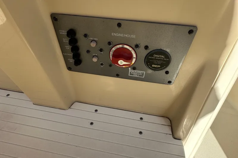 Slide: The Image of Control panel on 2017 Scout 251 XS boat, featuring switches and digital display. - 7