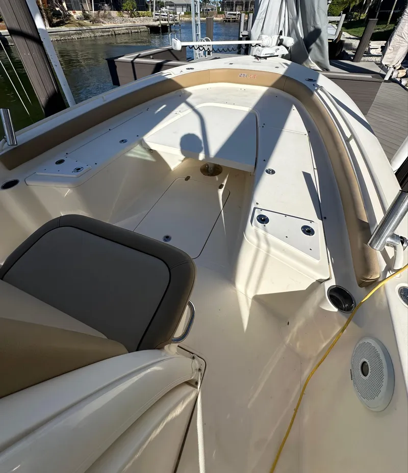 Slide: The Image of 2017 Scout 251 XS boat interior with seating and deck details. - 9