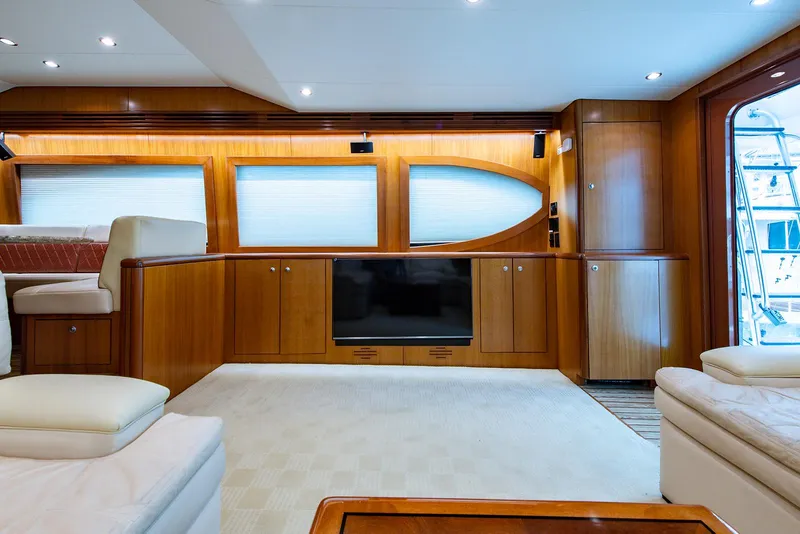 Slide: The Image of Luxurious interior of 2006 Hatteras 64 Convertible yacht with wood paneling and modern furnishings. - 11