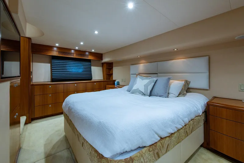Slide: The Image of Luxurious bedroom interior of 2006 Hatteras 64 Convertible yacht with modern furnishings. - 20
