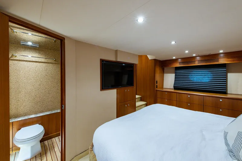 Slide: The Image of Luxurious bedroom and bathroom in 2006 Hatteras 64 Convertible yacht. - 21