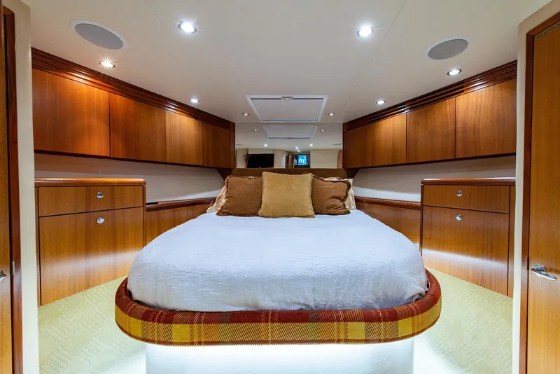 Slide: The Image of Luxurious cabin interior of 2006 Hatteras 64 Convertible yacht with elegant wood finish. - 25