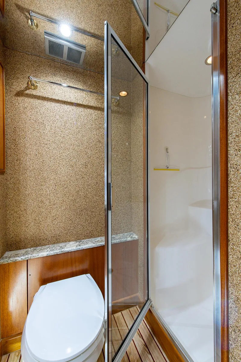 Slide: The Image of Bathroom interior of 2006 Hatteras 64 Convertible yacht with shower and toilet. - 34