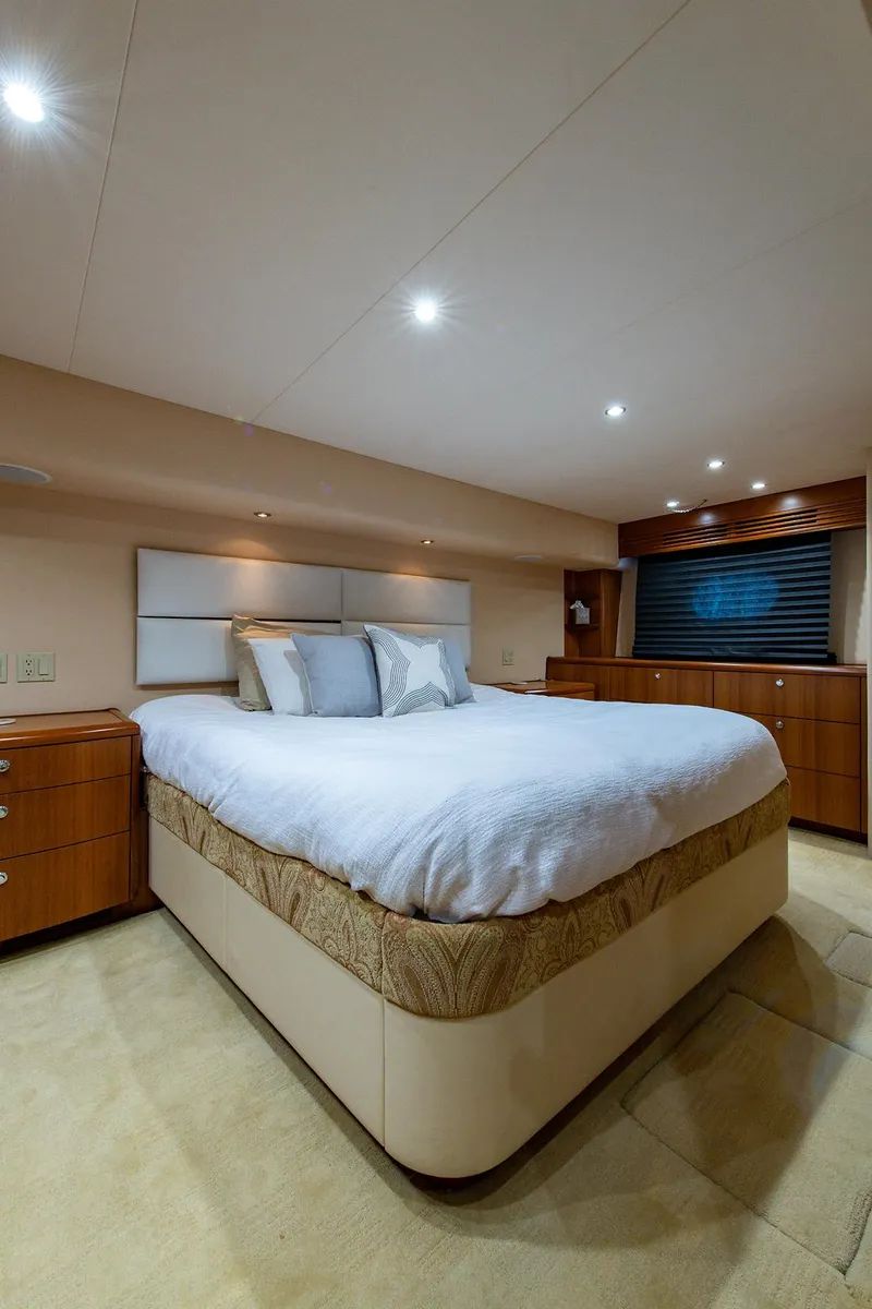 Slide: The Image of Luxurious bedroom interior of 2006 Hatteras 64 Convertible yacht with elegant lighting. - 36