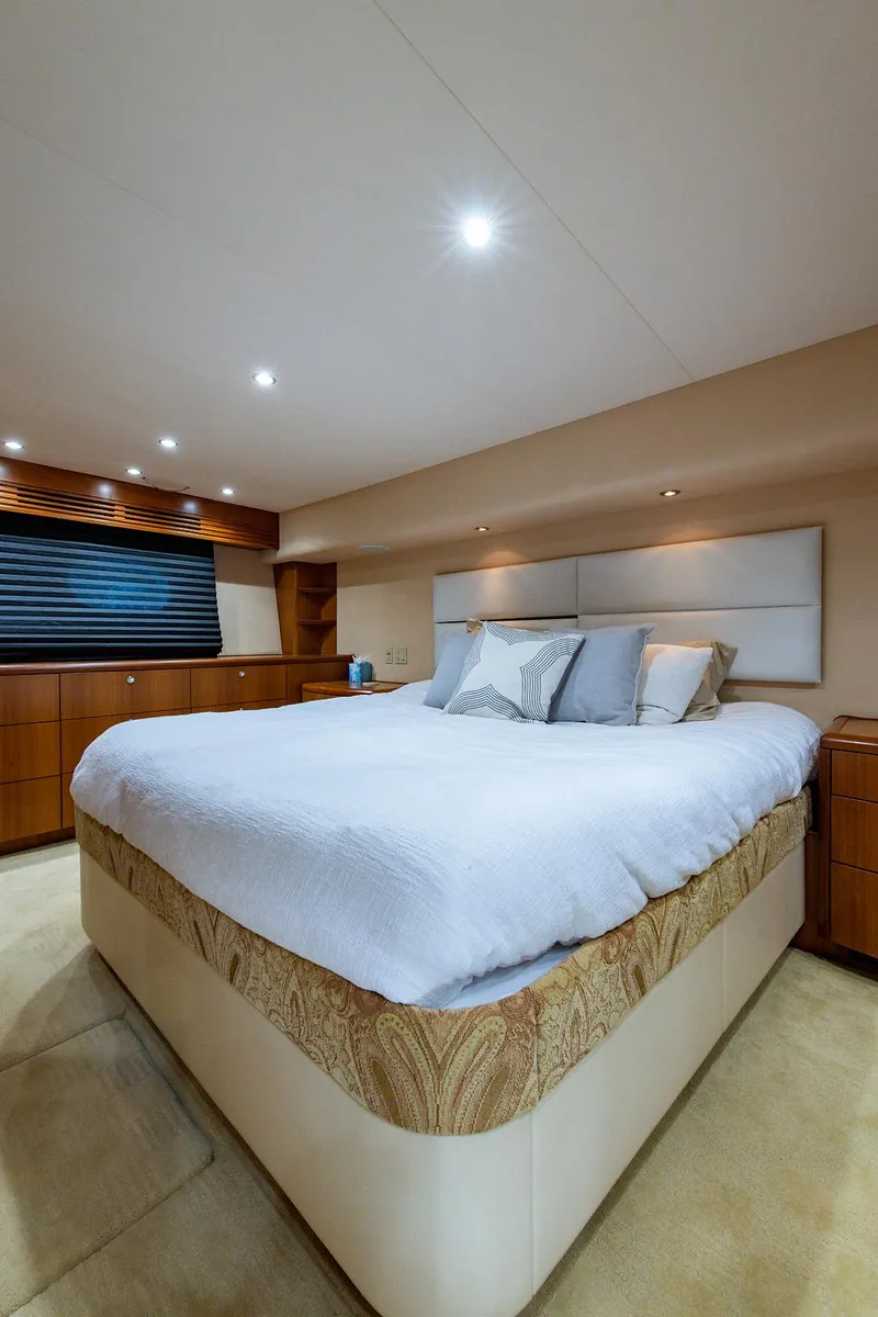 Slide: The Image of Luxurious bedroom interior of 2006 Hatteras 64 Convertible yacht with modern decor. - 37