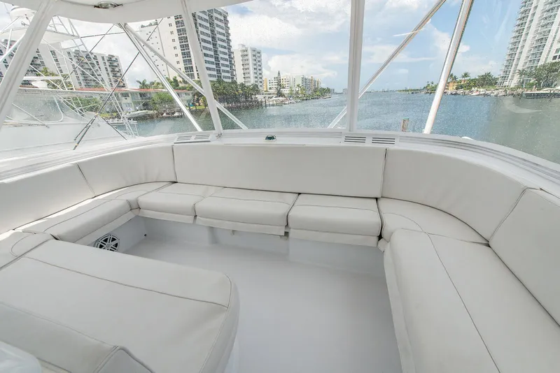 Slide: The Image of Spacious seating area on 2006 Hatteras 64 Convertible yacht with waterfront view. - 47