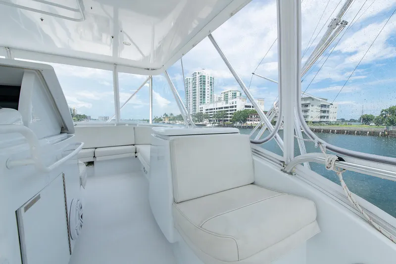 Slide: The Image of Luxurious interior of 2006 Hatteras 64 Convertible yacht with waterfront view. - 48