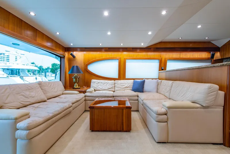 Slide: The Image of Luxurious interior of 2006 Hatteras 64 Convertible yacht with plush seating and elegant decor. - 8