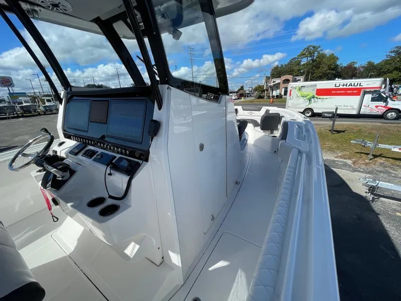 Slide: The Image of 2023 Fountain 32 NX boat interior with modern dashboard and controls. - 15