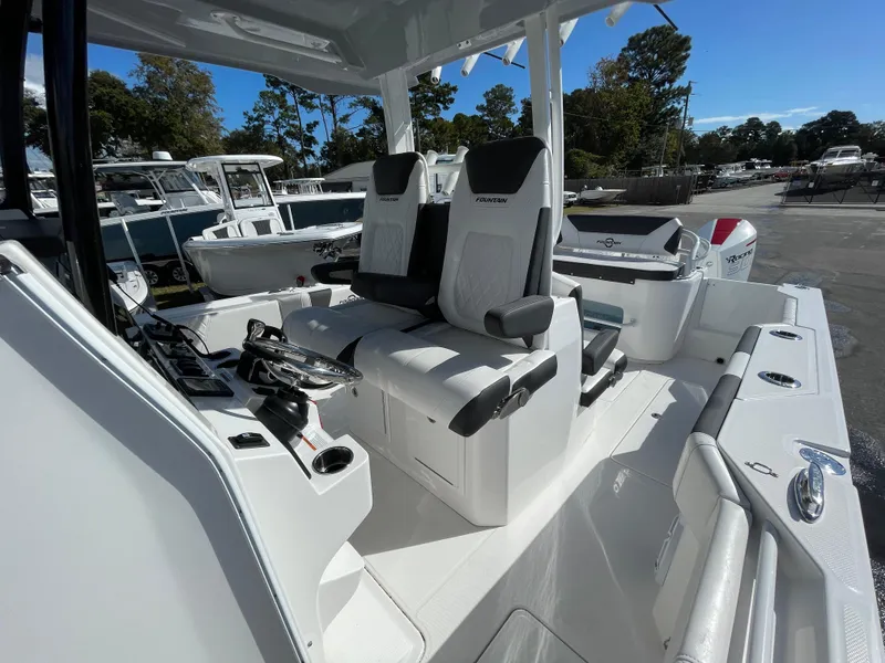 Slide: The Image of 2023 Fountain 32 NX boat interior with modern seating and controls. - 20