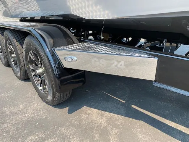 Slide: The Image of 2021 Nautique Super Air Nautique GS24 trailer detail with wheels and step plate. - 10