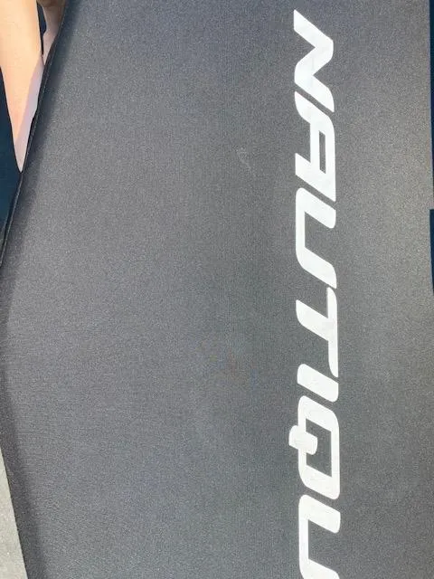 Slide: The Image of 2021 Nautique Super Air Nautique GS24 logo on a sleek black surface. - 13