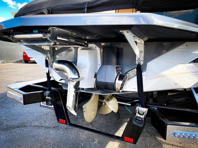 Slide: The Image of 2021 Nautique Super Air Nautique GS24 boat stern with propeller and exhaust system. - 14
