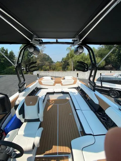 Slide: The Image of 2021 Nautique Super Air Nautique GS24 boat interior with sleek seating and modern design. - 18