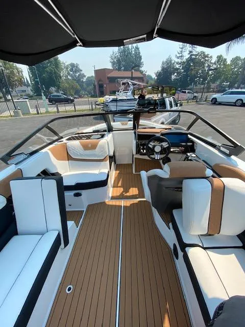 Slide: The Image of 2021 Nautique Super Air Nautique GS24 interior with sleek seating and modern design. - 21