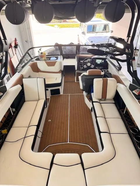 Slide: The Image of 2021 Nautique Super Air Nautique GS24 boat interior with spacious seating and modern design. - 24