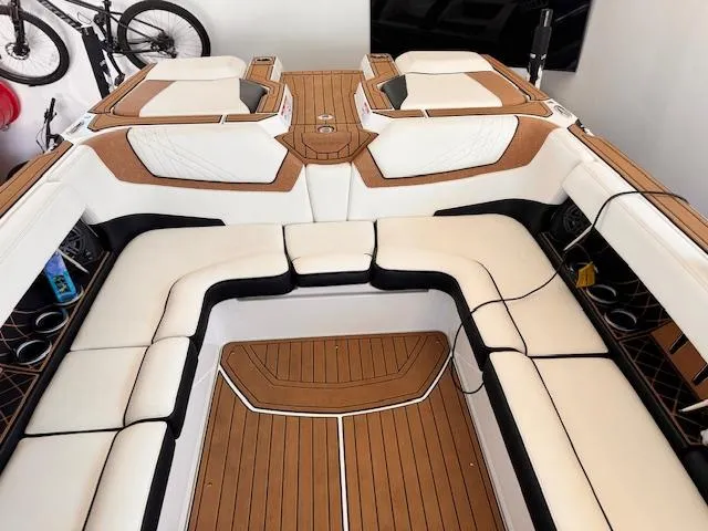 Slide: The Image of 2021 Nautique Super Air Nautique GS24 interior with white and tan seating. - 25