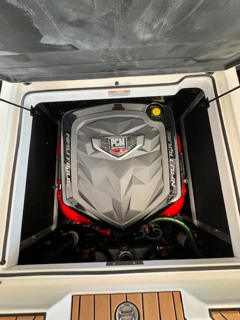 Slide: The Image of 2021 Nautique Super Air Nautique GS24 engine compartment with PCM engine. - 36