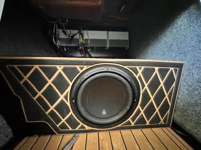 Slide: The Image of Subwoofer installation in 2021 Nautique Super Air Nautique GS24 boat, featuring custom design. - 38