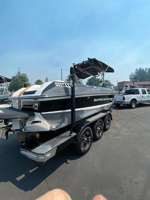 Slide: The Image of 2021 Nautique Super Air Nautique GS24 boat on trailer in parking lot. - 9