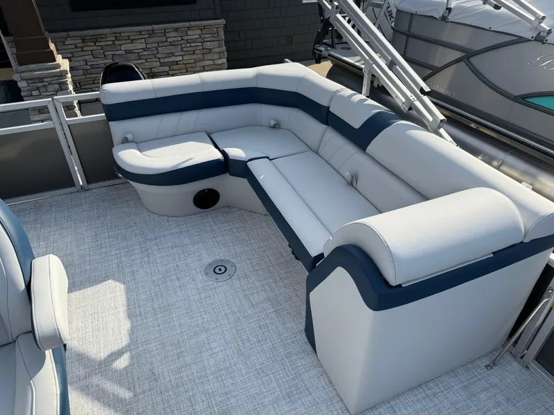 Slide: The Image of 2025 South Bay 20CR SE S pontoon boat with plush seating and modern design. - 11