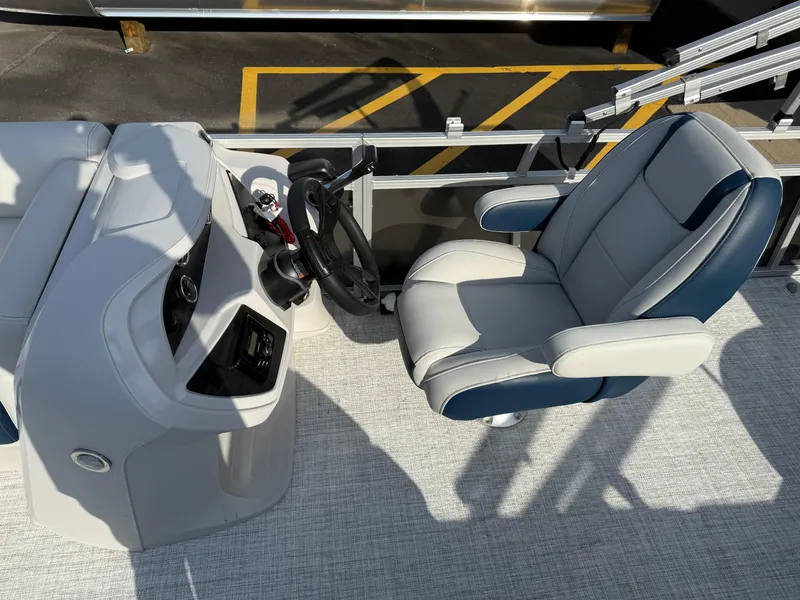 Slide: The Image of Captain's chair and helm of 2025 South Bay 20CR SE S boat. - 12