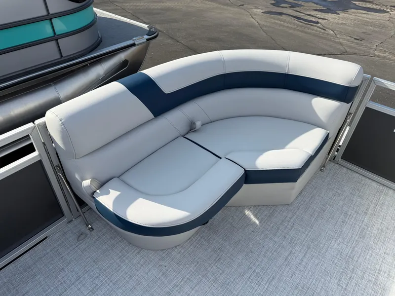 Slide: The Image of 2025 South Bay 20CR SE S boat with stylish curved seating in white and blue. - 15