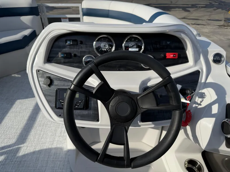 Slide: The Image of Steering console of 2025 South Bay 20CR SE S boat with gauges and controls. - 9